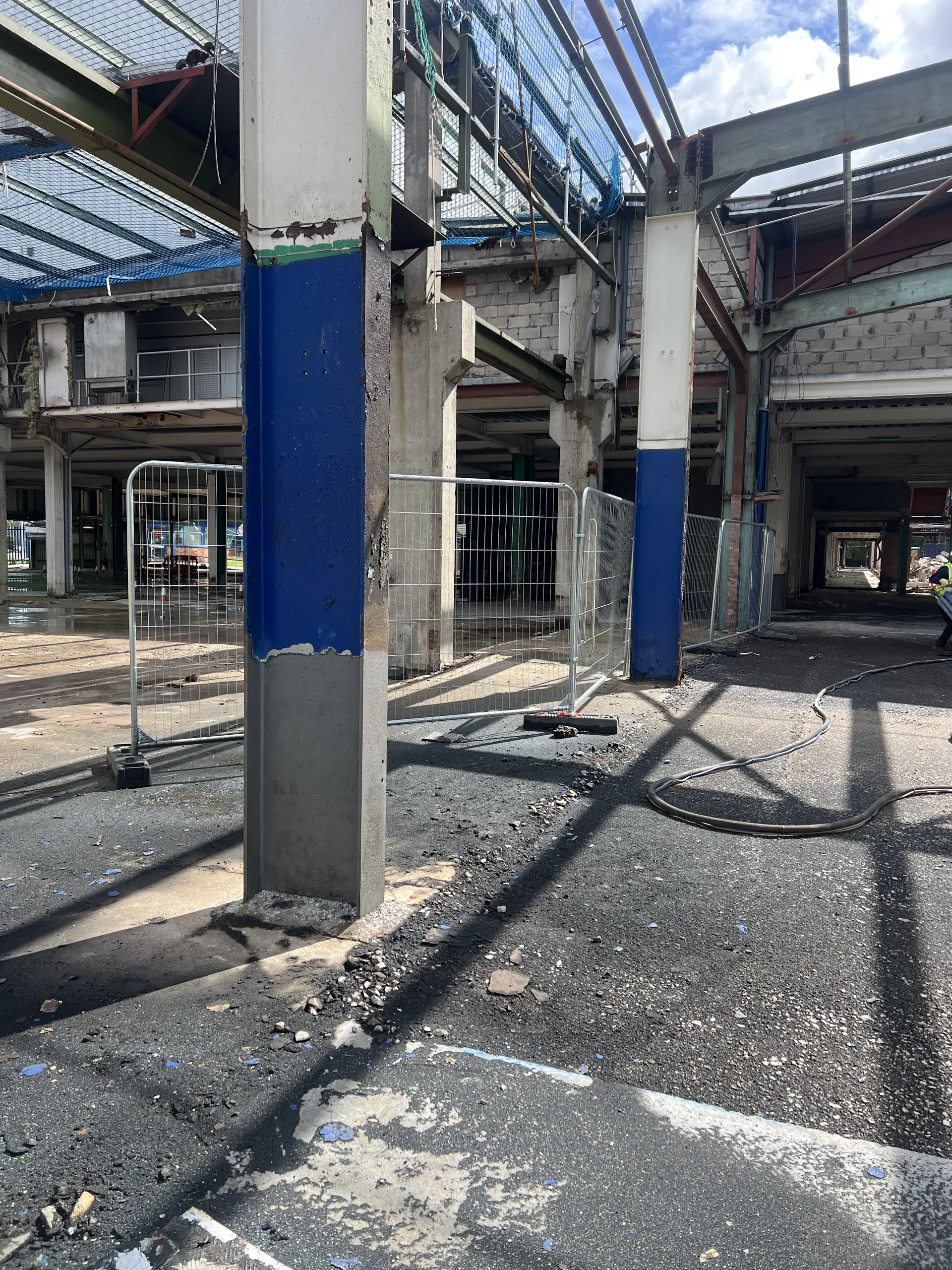 Related steel column with prepared lower section in the industrial work area