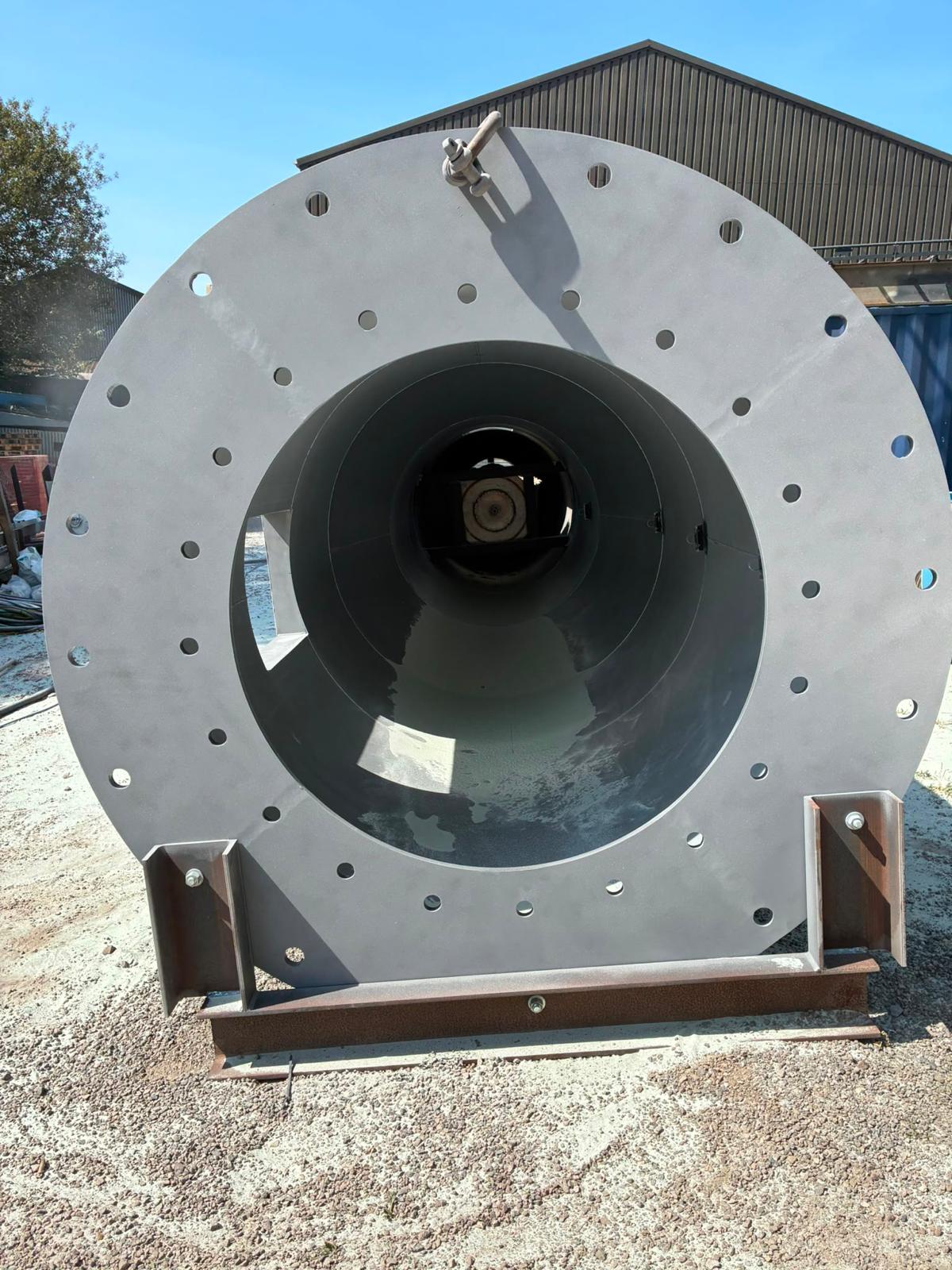 Steel chimney after shot blasting — end-on view of the clean fabricated steel section