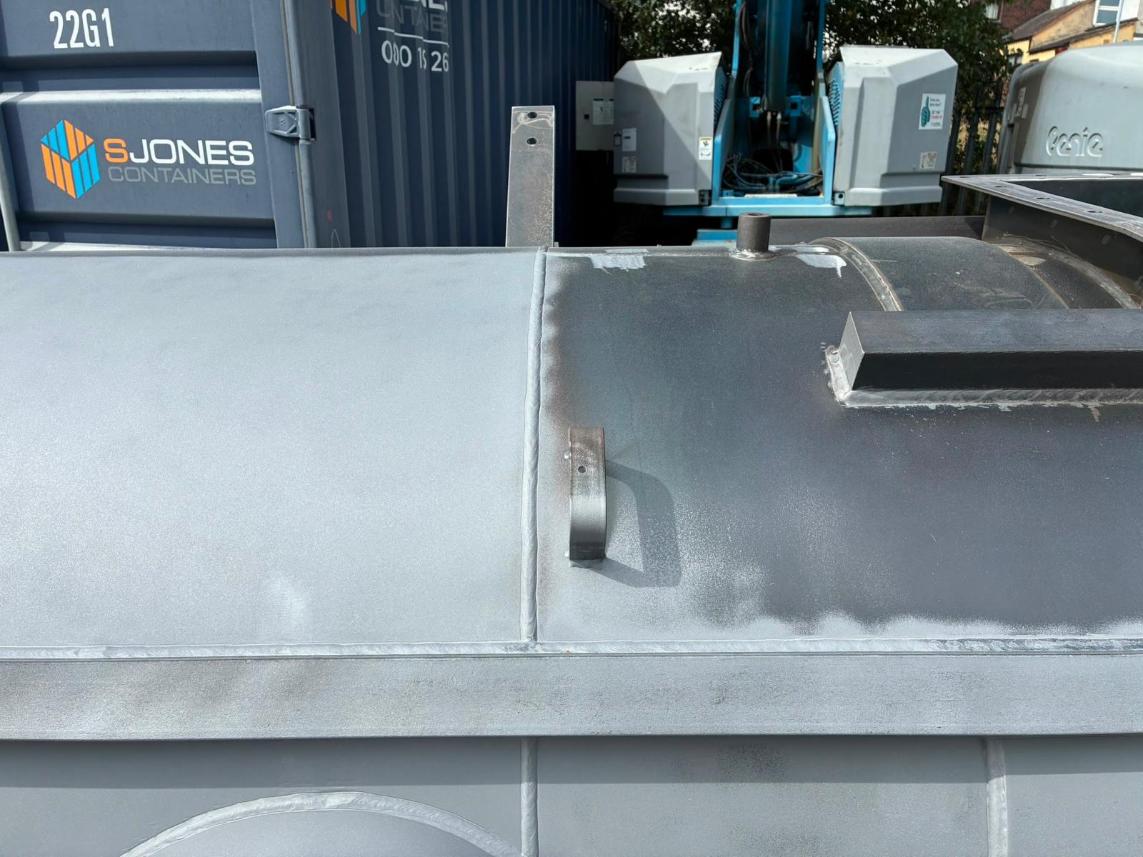Steel chimney during preparation — close view of the cleaned fabricated steel surface
