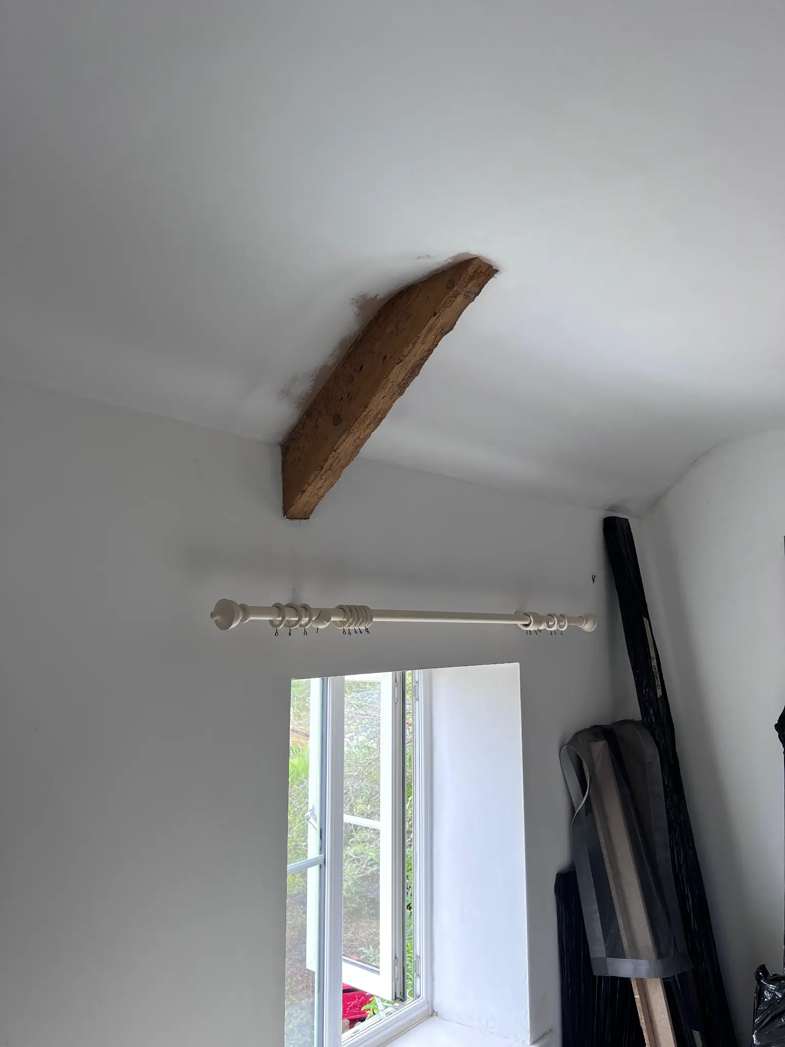 Natural timber feature beam above the window after restoration